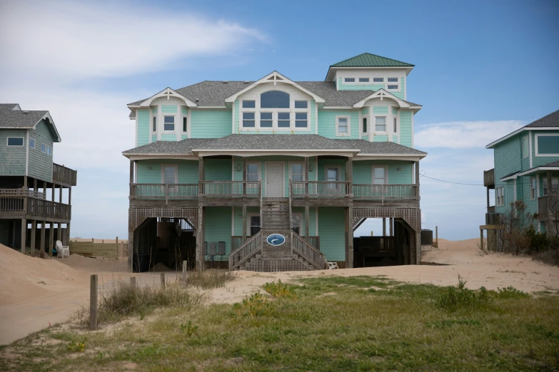 an oceanfront house with several levels above it