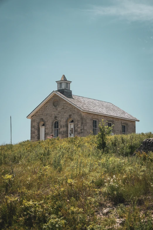 an old church built on the top of a hill