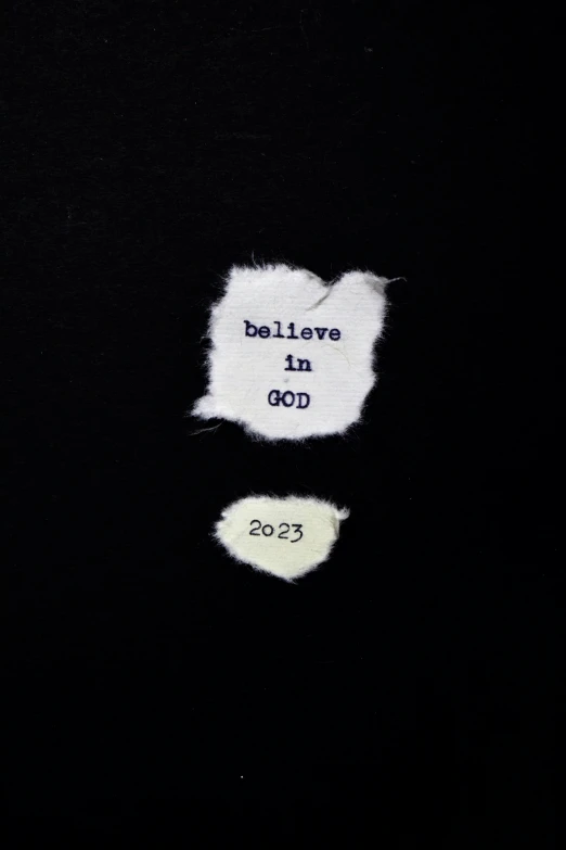 a po of the back of a black shirt with the words believe in dop written in the front