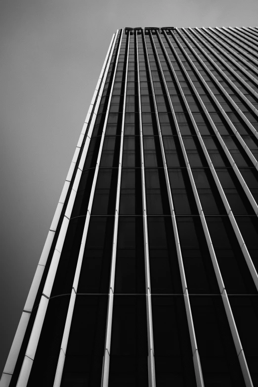 a tall skyscr is seen in black and white