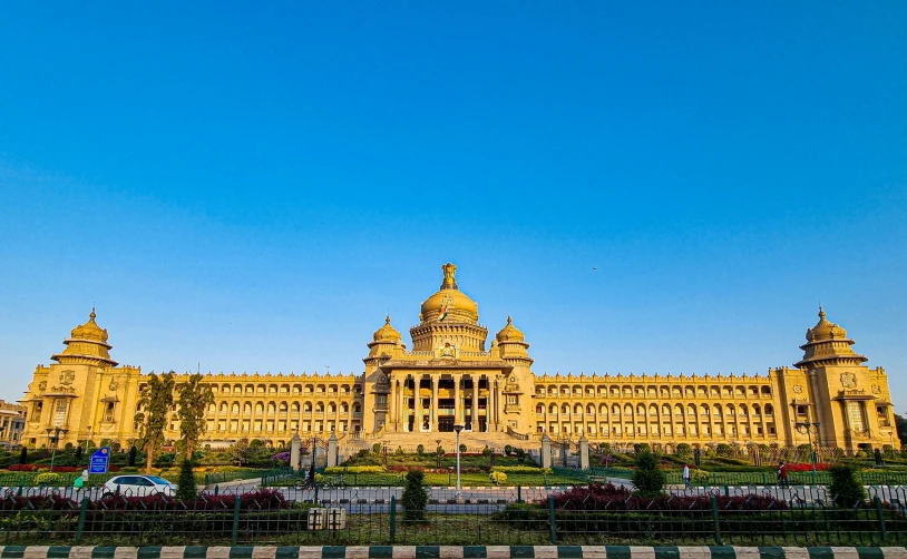 a very large building with tall towers in front of it