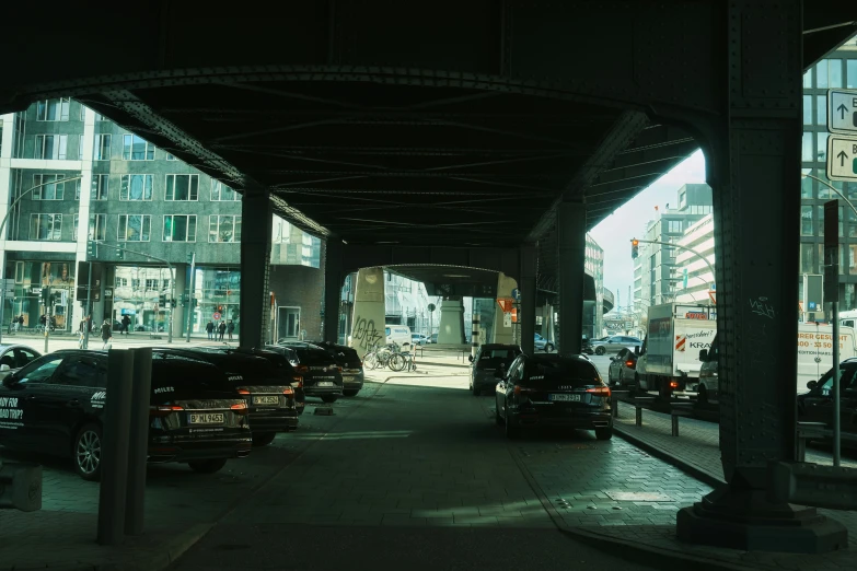 many cars stopped at a stop light on a city street