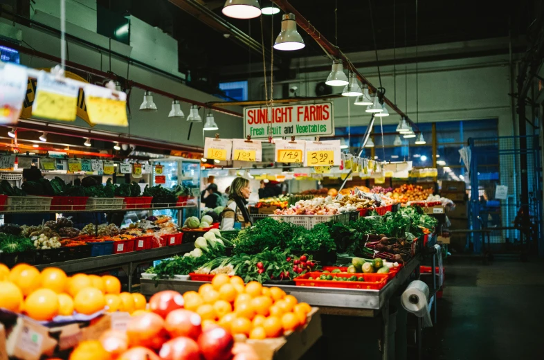 a farmers market with lots of fruits and vegetables