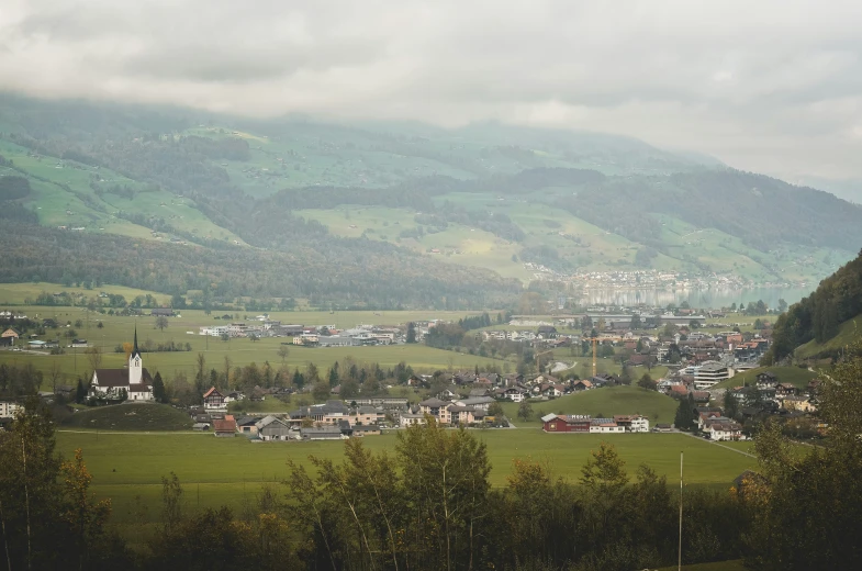 a large city with mountains in the background