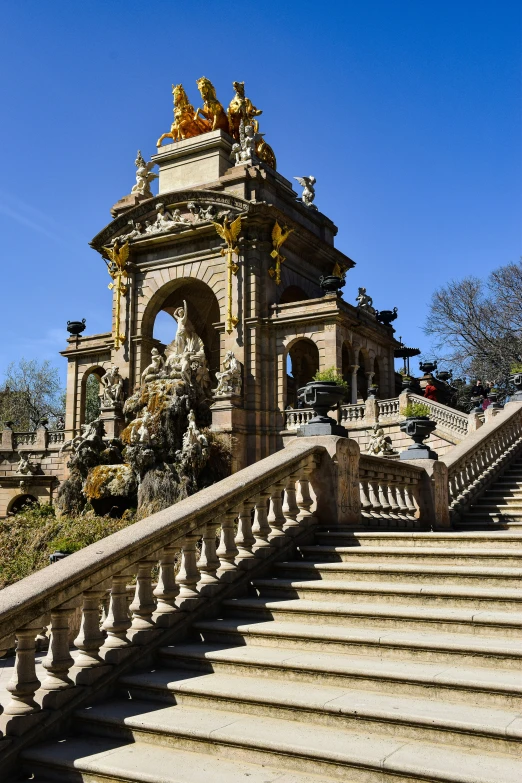 a large statue of animals is on the stairs