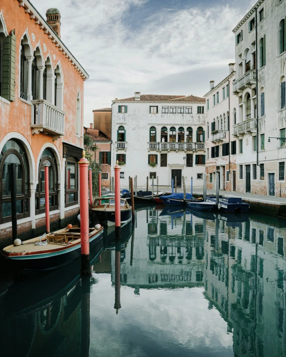 a street with boats and old buildings