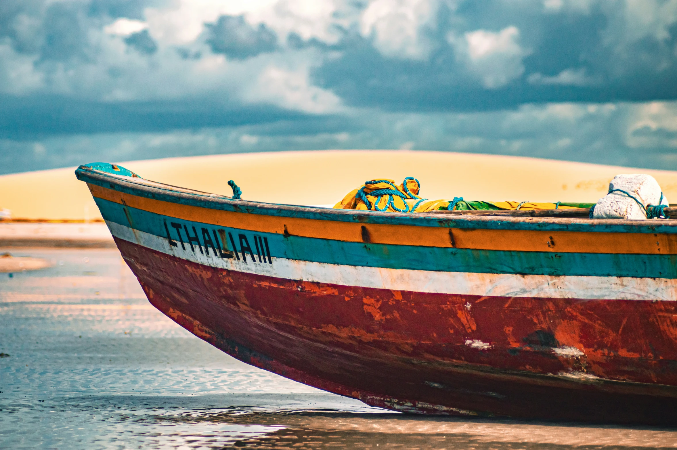 the front of an old boat near water