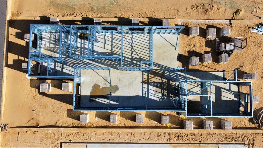 a large metal structure sitting on top of dirt