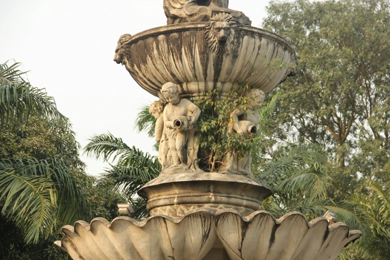 the statue has two bears in it's water fountain