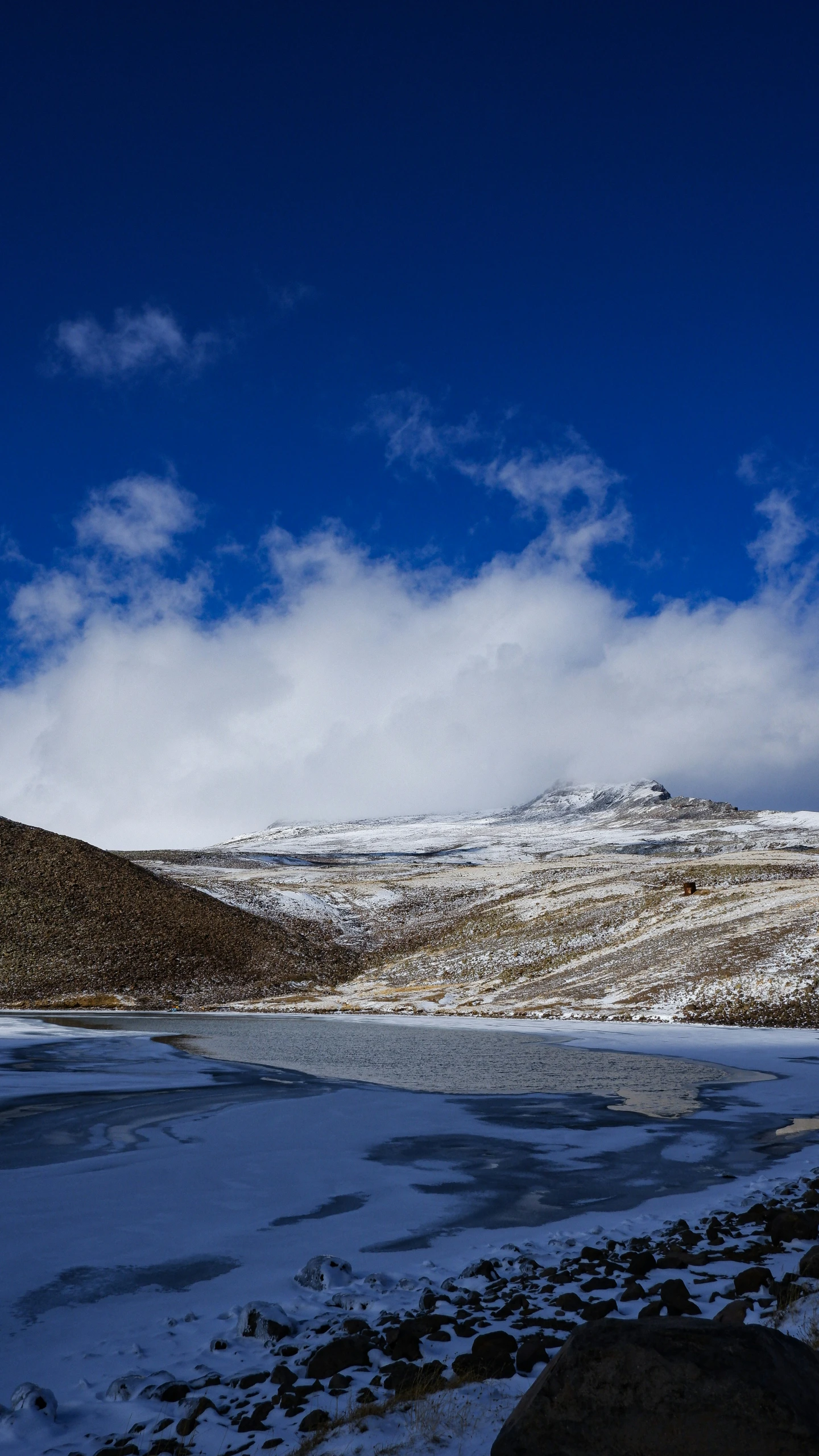 a picture of a snowy area with some rocks