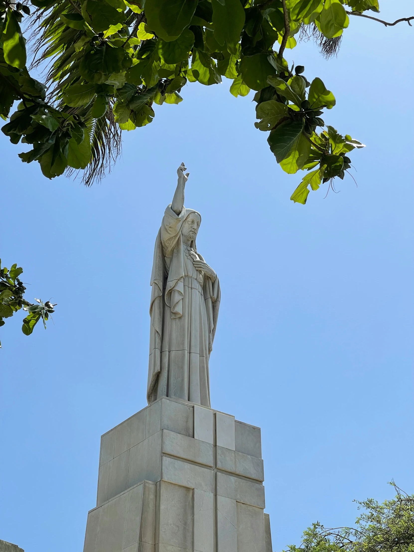 a monument with a statue of jesus in it