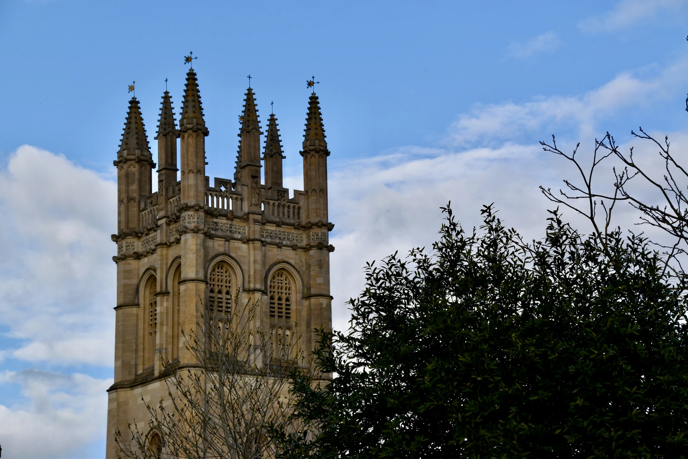 a church steeple and birds perched on it