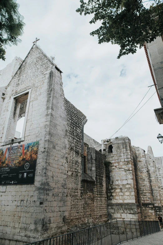 an old brick building with an opening that shows through