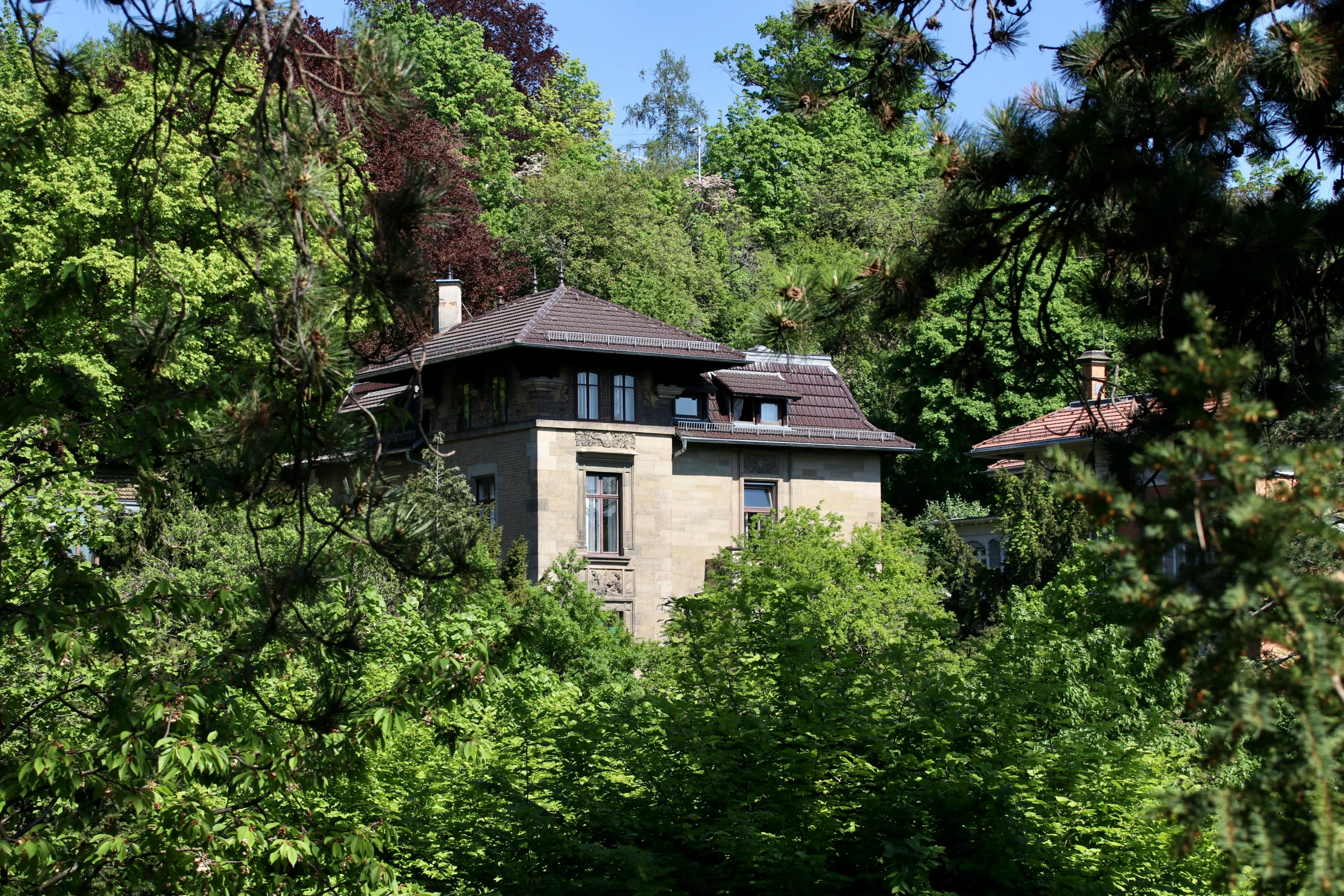 a building in the middle of some trees