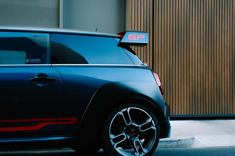 an electric car parked in front of a building