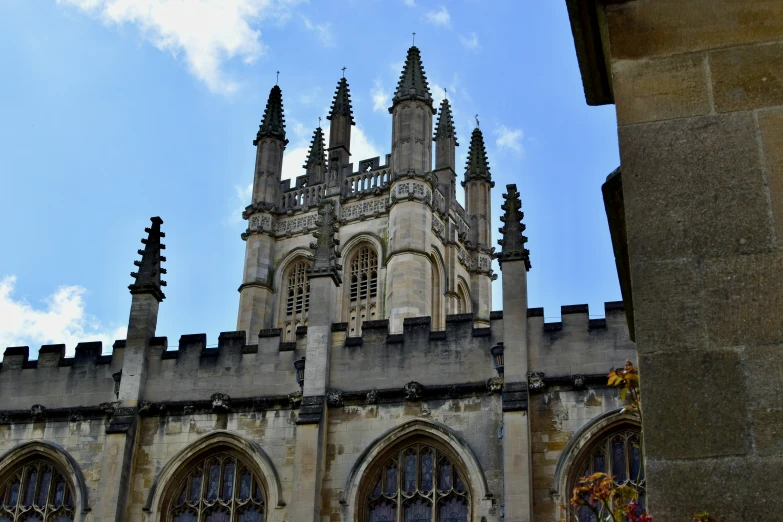 an old gothic church with a tower and clock