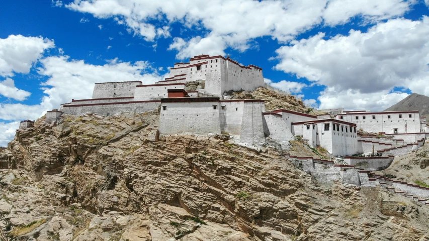 a stone structure on the top of a cliff