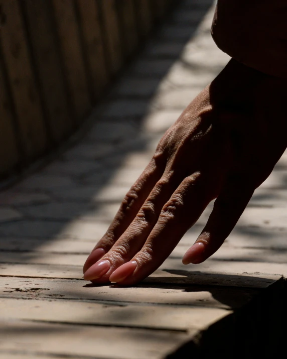 the sun is shining on a persons hand