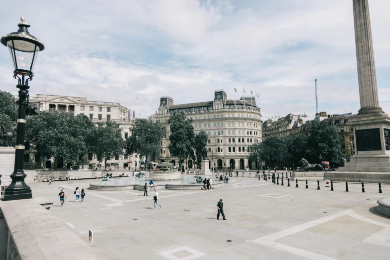 some people standing on a very big plaza