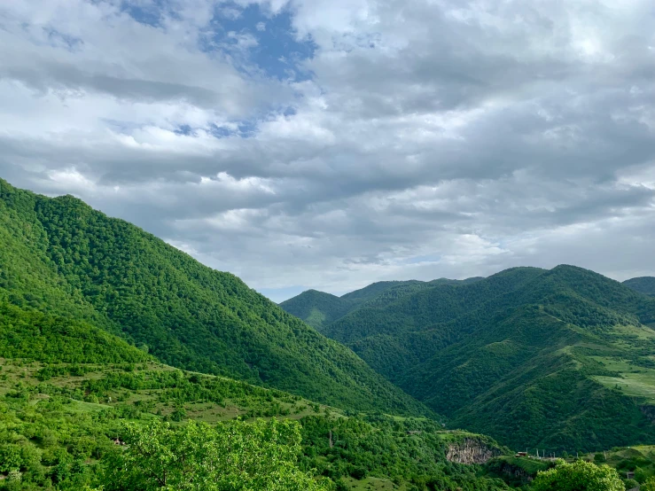 mountain and valley area, during the day, on partly cloudy day