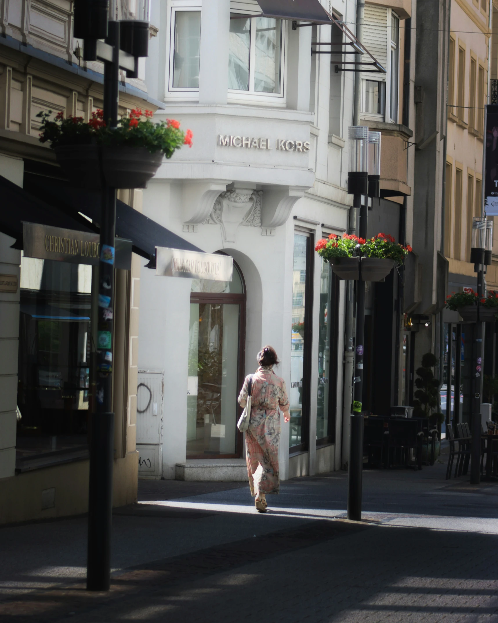 there is a woman walking in the street