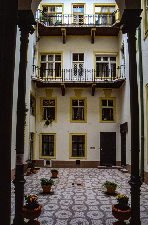 courtyard in a building with two balconies in the center