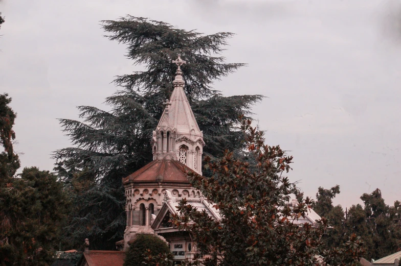 the steeple of a church with the clock on it is shown