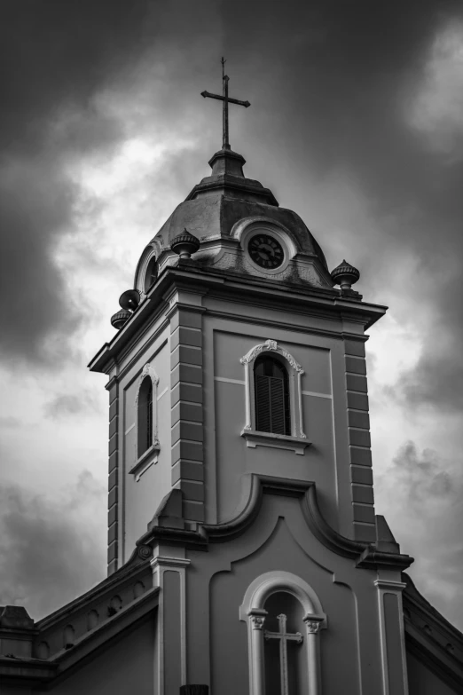 the clock tower is tall and black with white trim