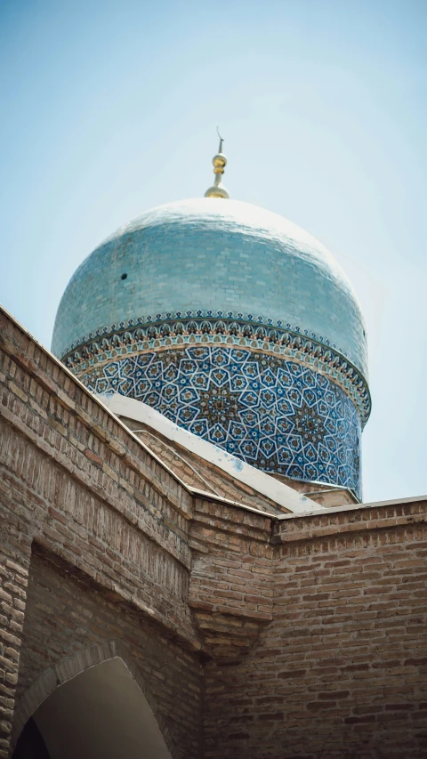 the top of a building that has a blue dome