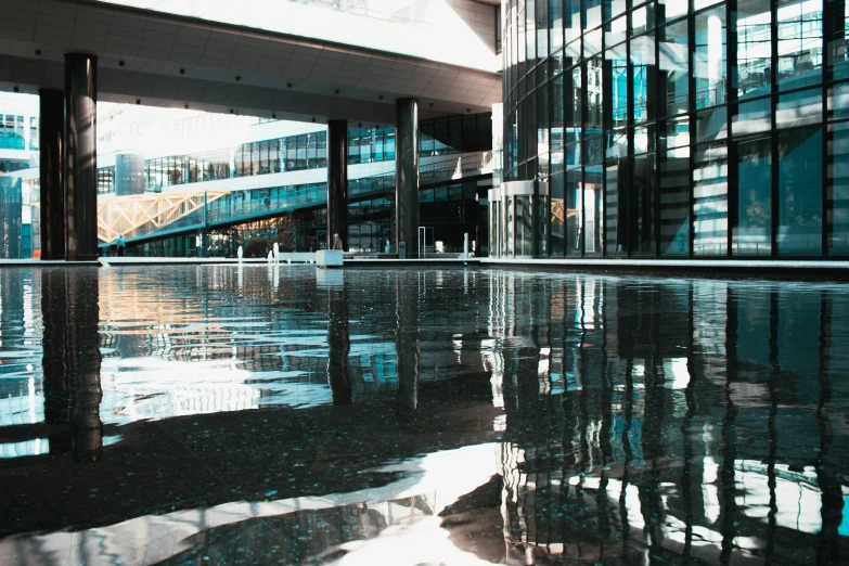 building reflections on the surface of a pool