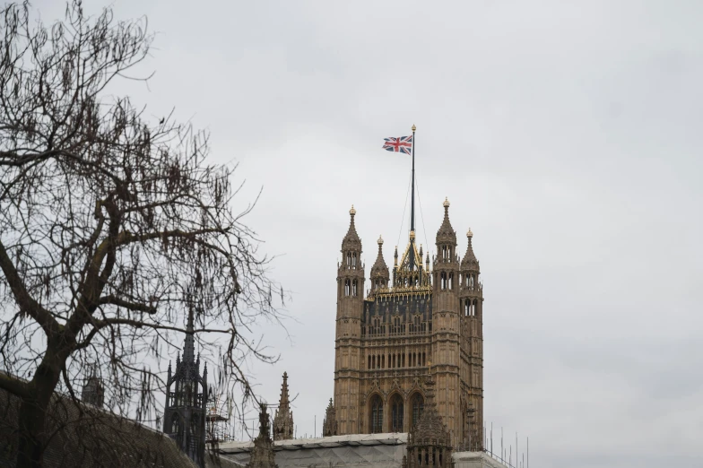 view of the big ben clock tower with a british flag on top