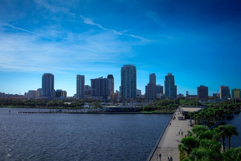 there is a city skyline with skyscrs seen from the water