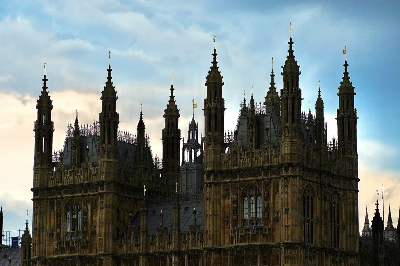 several clocks on large towers and the sky