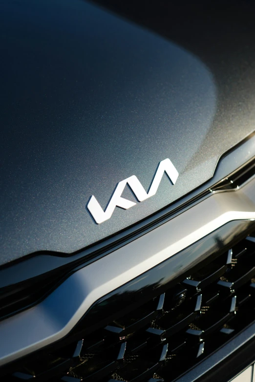 closeup of the front grille and emblem on a black suv