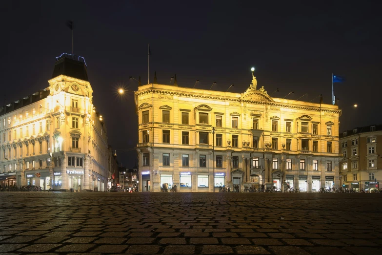 a building with lights in the front is lit up