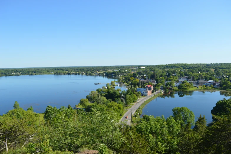 view from a hill overlooking a large lake