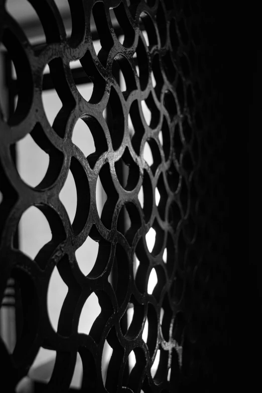 an intricate pattern on the inside of an iron grille