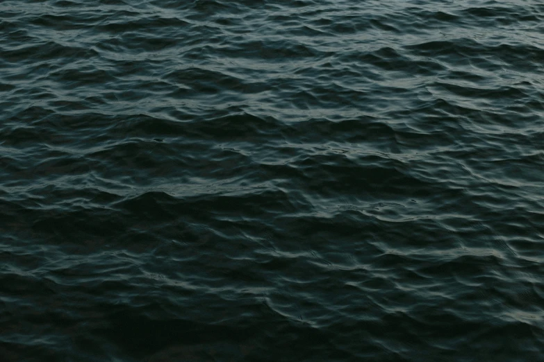 an airplane is seen above the blue water