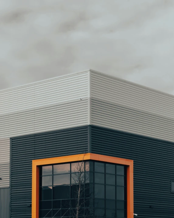 a building with a yellow frame is surrounded by fog