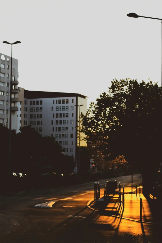 two buildings in the background with street lights