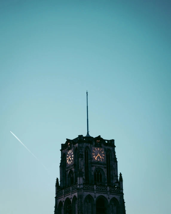 an image of a tower clock with time on it