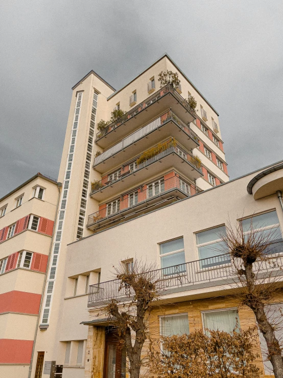 the back side of a building against a cloudy sky