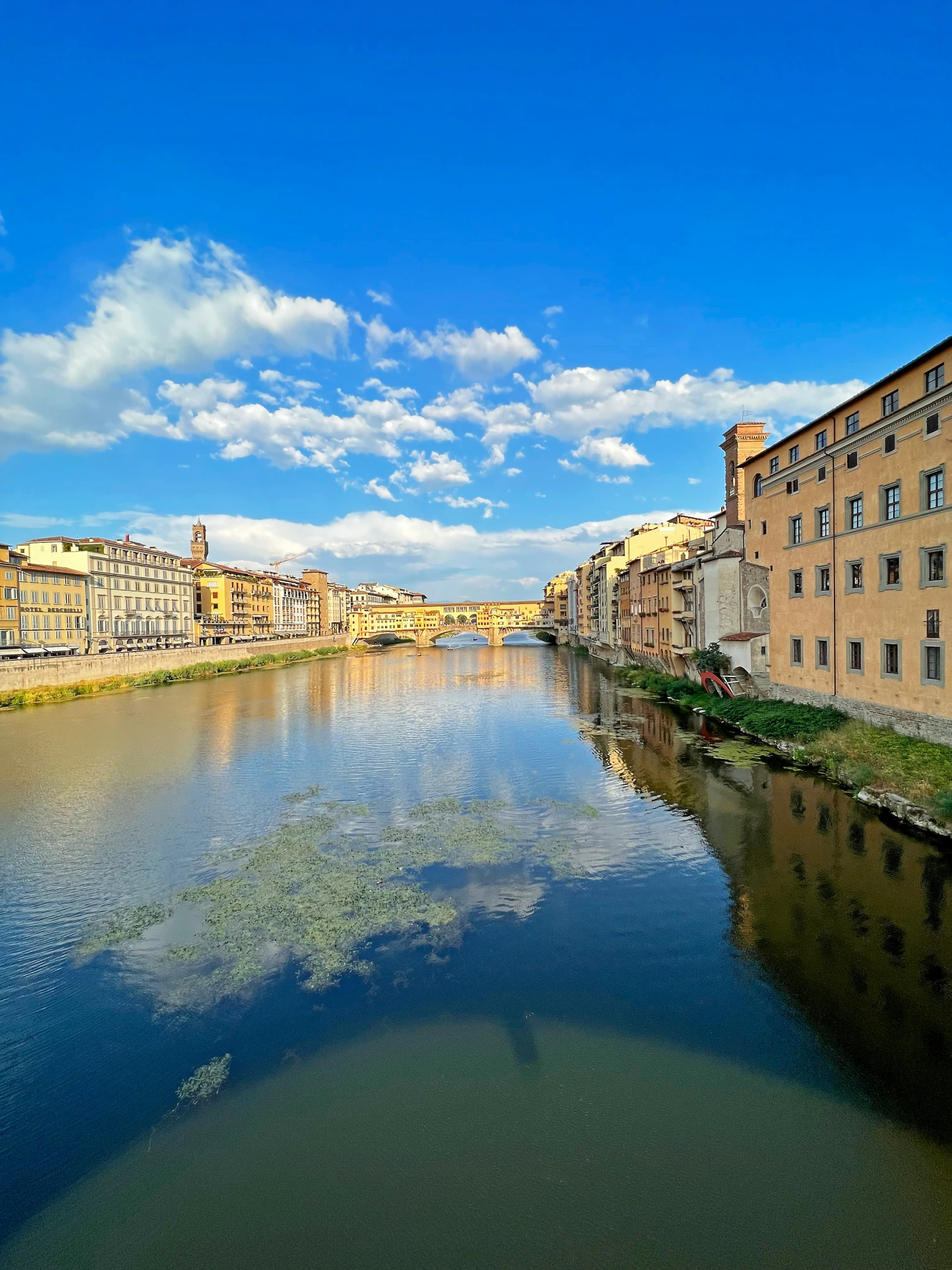 a river running past some buildings next to it