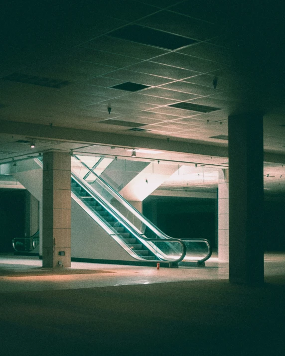 an escalator with railings and two benches next to it