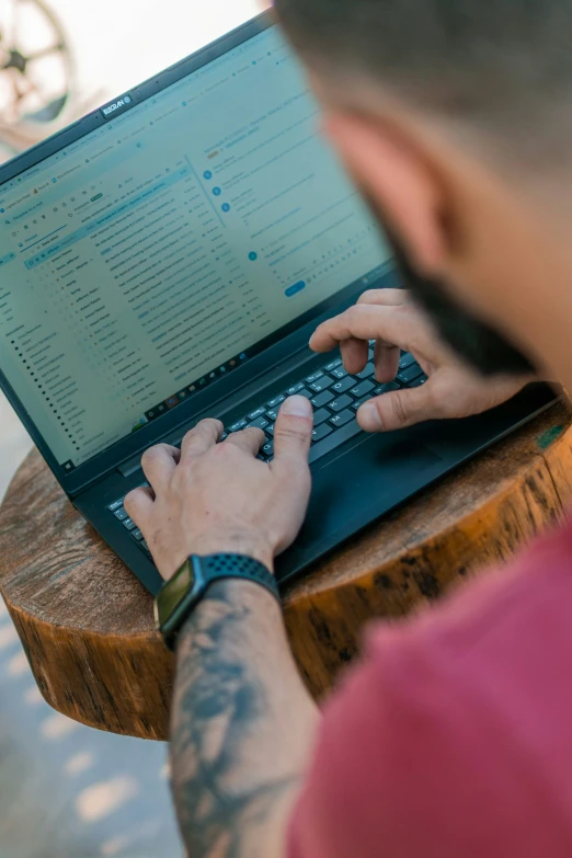 a person that is on a laptop on a table