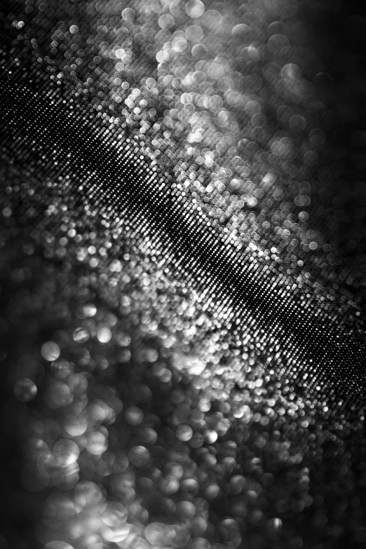 an abstract black and white po with small bubbles