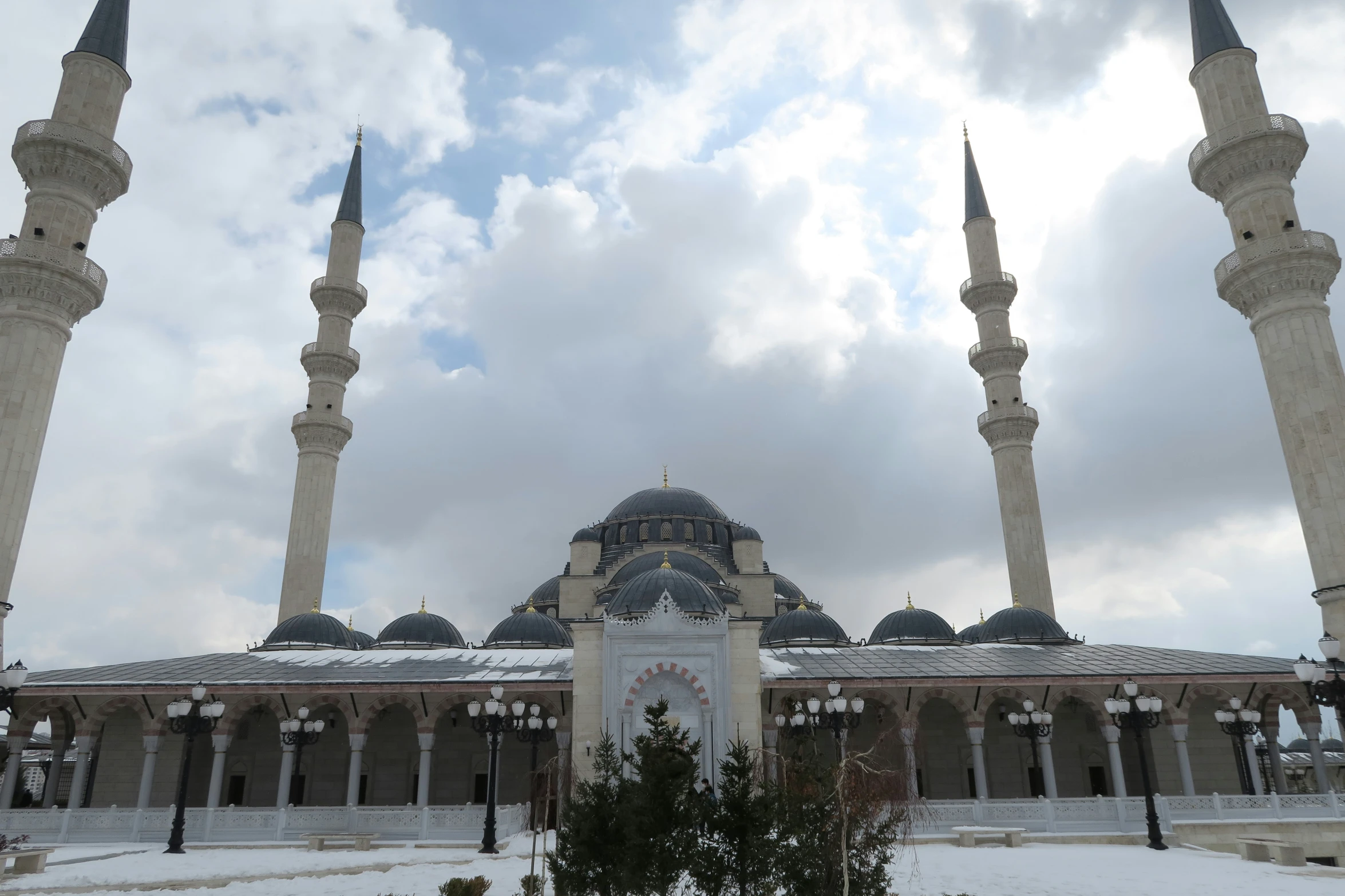 the view of a mosque with many minalis in the background