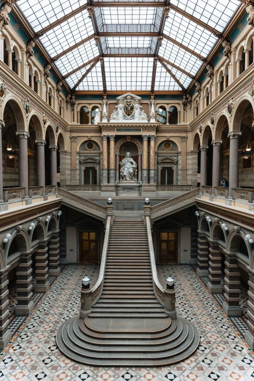 the inside of a building with a massive floor and a high ceiling