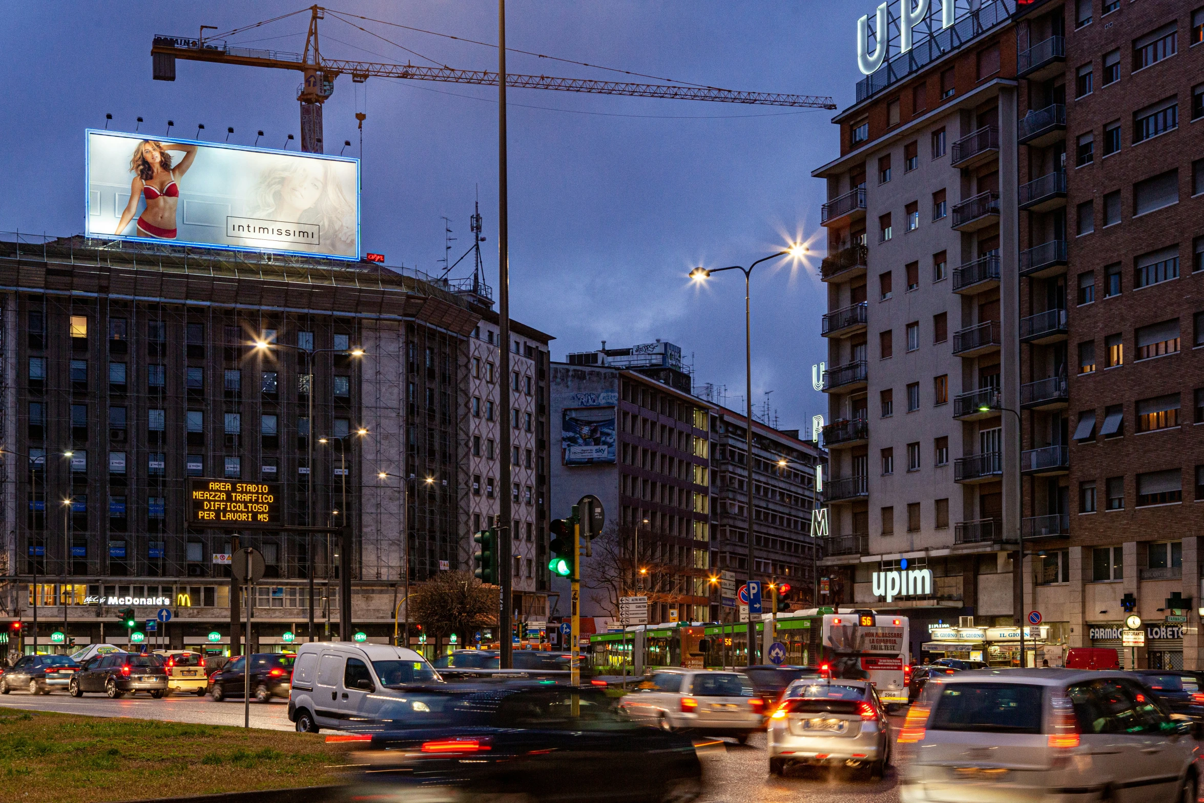 many cars traveling down a city street at night