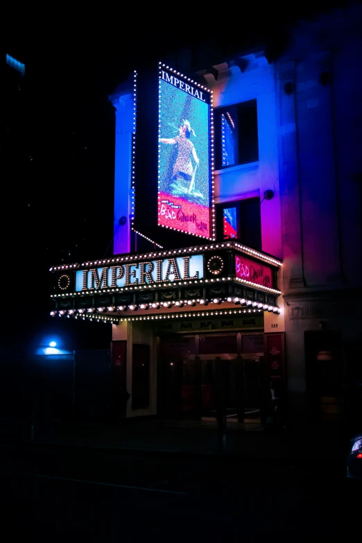 a brightly lit building that says broadway on the side